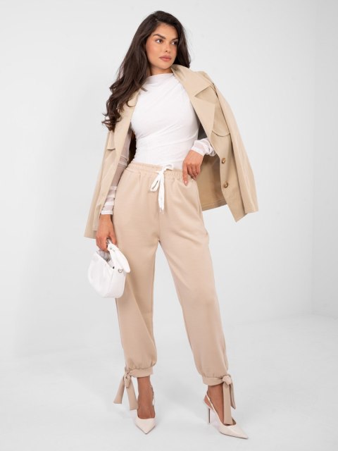 Beżowe spodnie dresowe masełko z wiązanymi nogawkami
