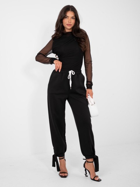 Czarne spodnie dresowe masełko z wiązanymi nogawkami