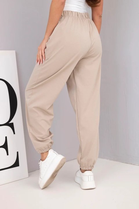 Spodnie damskie bawełniane z wysokim stanem i ozdobnym guzikiem beżowe