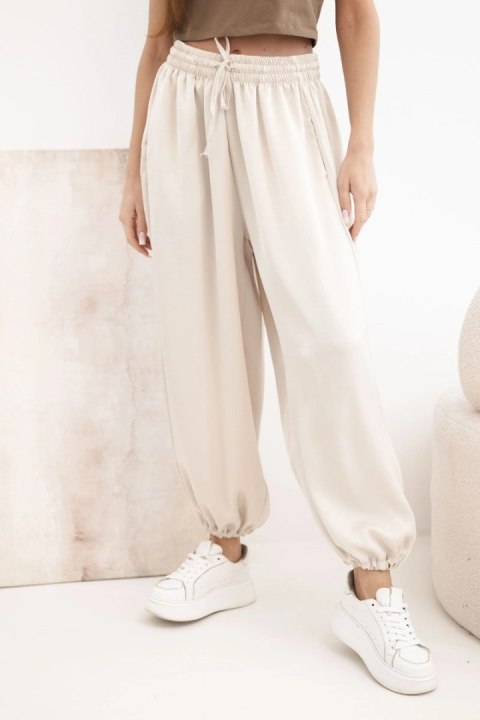 Beżowe spodnie damskie alladynki z szeroką nogawką