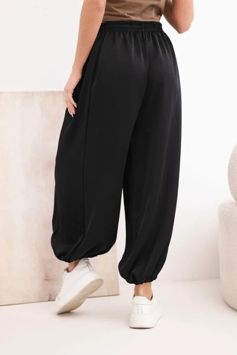 Spodnie damskie szerokie z gumką w pasie i wiązaniem typu alladynki czarne