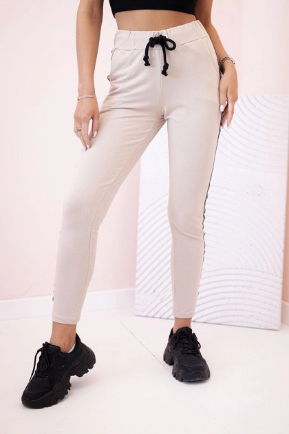 Spodnie damskie dresowe z lampasem i wiązaniem w pasie beżowe