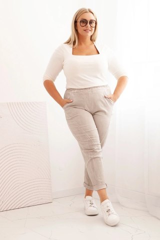 Spodnie damskie dekatyzowane Plus Size z gumką i kieszeniami beżowe